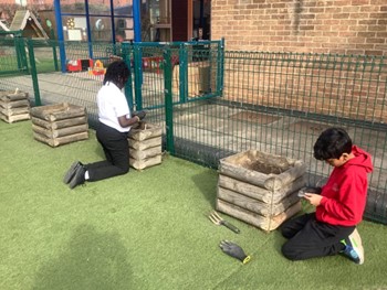 Children planting outside